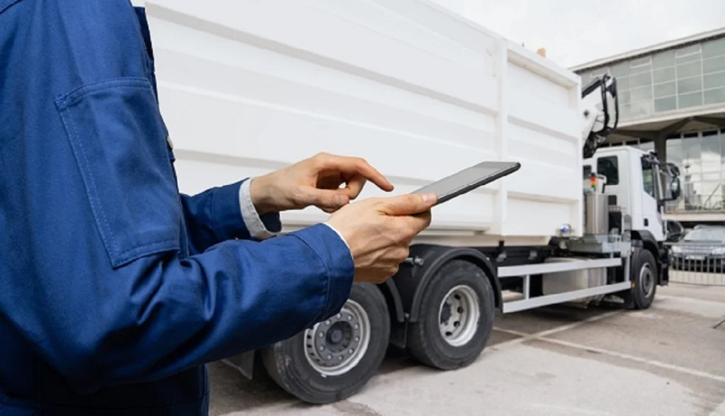 Fleet manager reviewing telematics data on a tablet