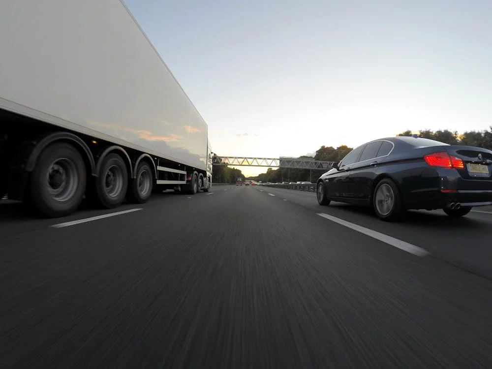 truck and car on highway