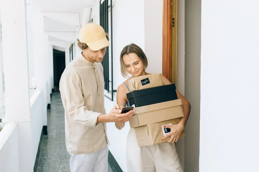 Woman holding packages with man