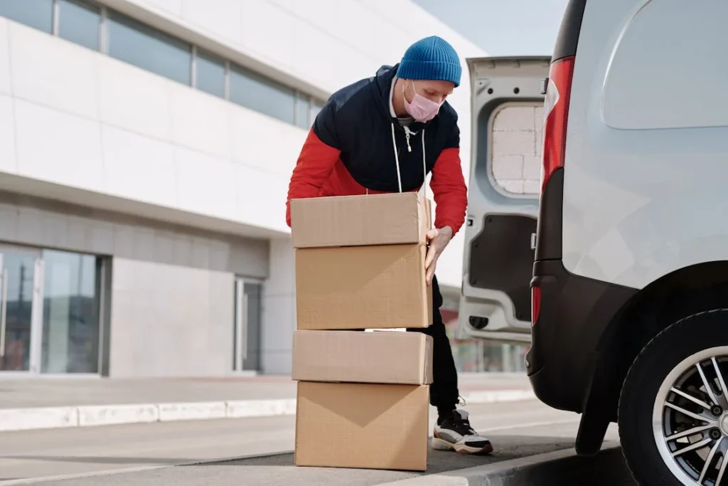 Man loading boxes into truck