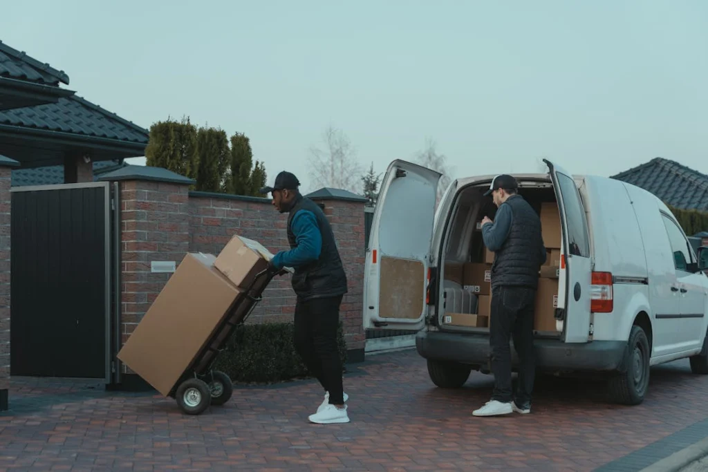 Men unloading boxes from truck