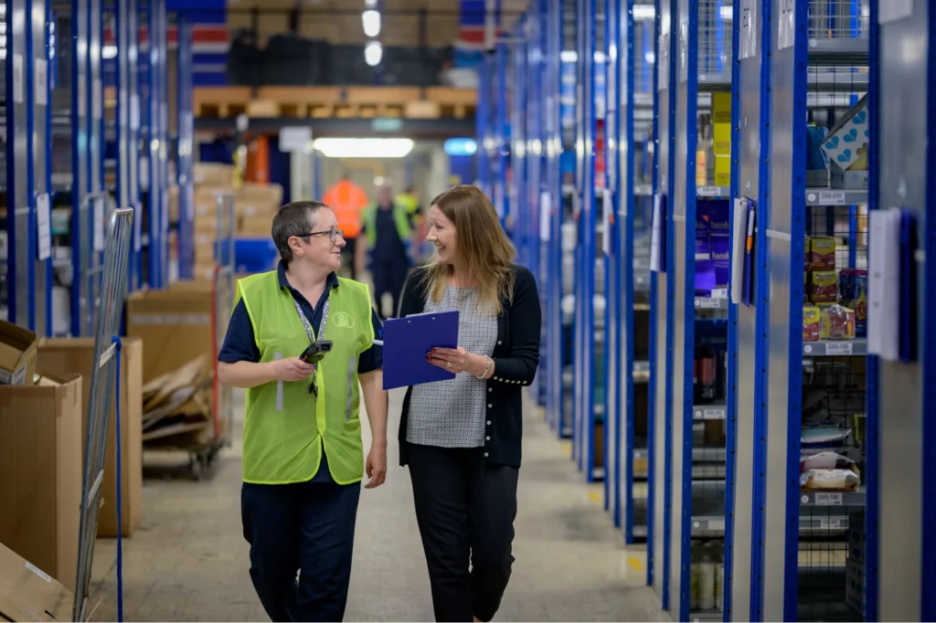 Employees talking in a last-mile delivery hub