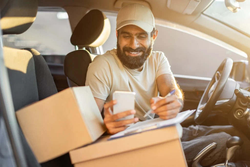 Delivery driver checking an address on a smartphone