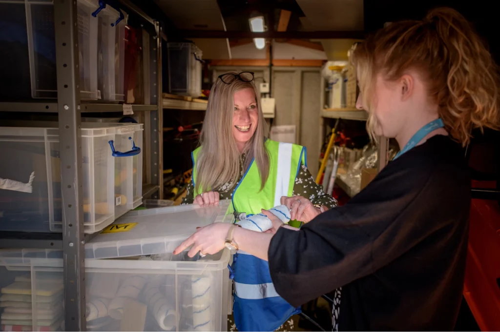 Warehouse workers picking items from totes