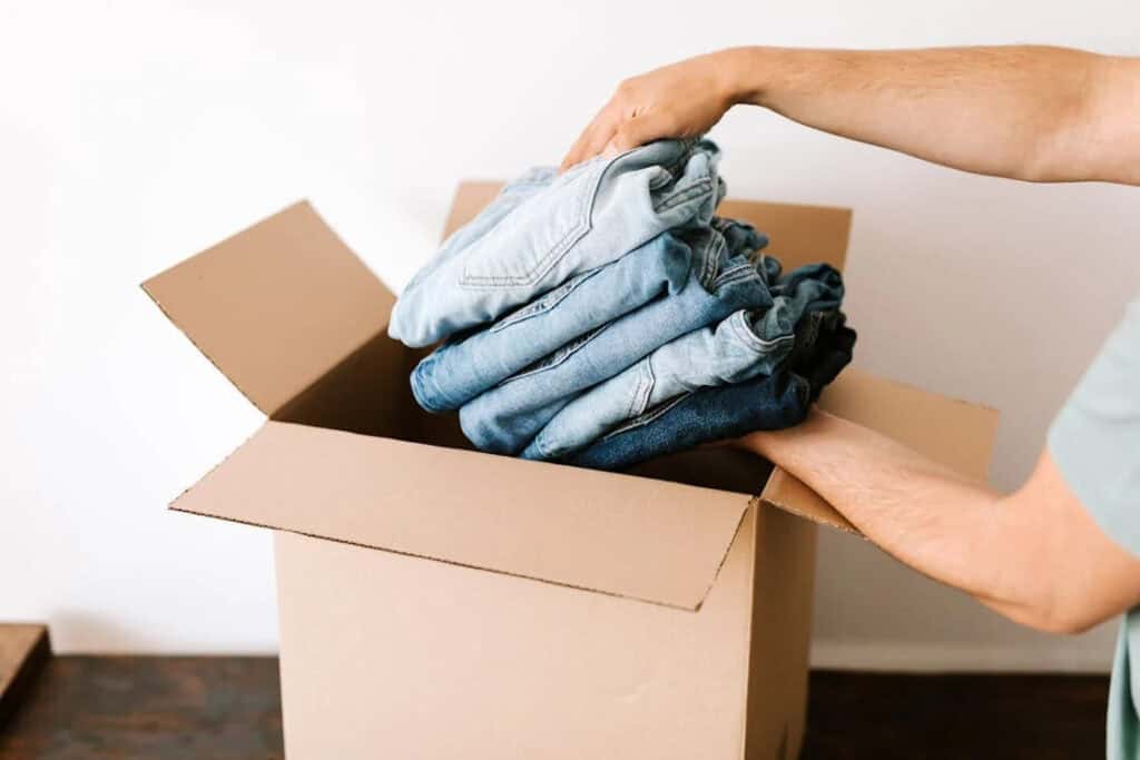 Putting clothing in a box for shipment